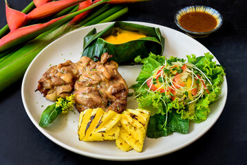 Vietnamese chicken boneless legs with baby corn under cheese, salad and grilled pineapple