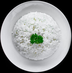 Plate with white rice, serving for Vietnamese dishes on black background
