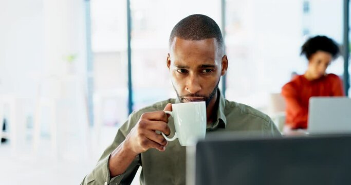 Coffee, laptop or black man thinking or reading an online blog in office with vision, innovation or ideas. Drinking tea, solution or serious journalist reading copywriting research in digital agency