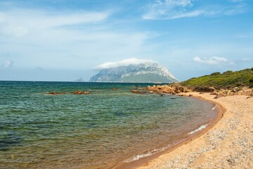 Fototapeta premium Landscape of the Sardinian sea surrounded by a beach near Porto Taverna, Italy