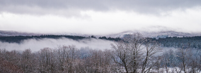 banner of foggy rainy morning in late winter in Vermont rural landscape 
