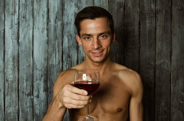 Young attractive guy with a beautiful body posing in the studio.