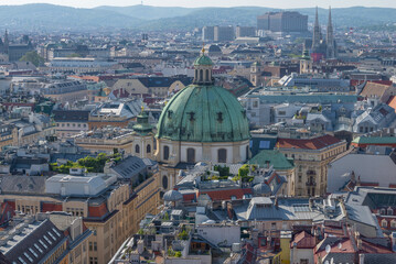 Dome of St. Peter's Church in cityscape on April afternoon. Vienna, Austria