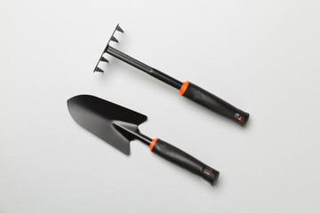 Gardening tools on color background, top view