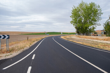 curvy road in the plains of Castilla, Spain