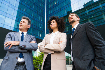 Multiethnic business people meeting in a business park - Multiracial group of corporate colleagues 