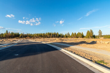 Vacant land is readied for a rural community of new homes in a subdivision in the early stages in a suburb of Spokane, Washington, USA	