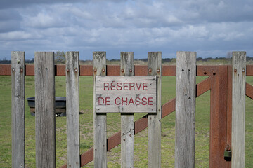 wooden barrier with inscription: hunting reserve