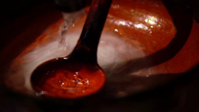 Preparation of queimada alcohol drink during San Juan holiday in Galicia, Spain