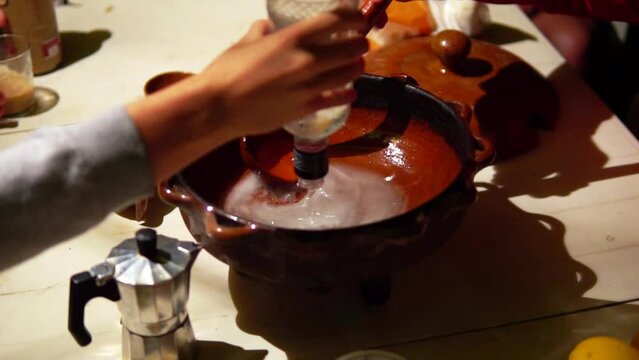 Preparation of queimada alcohol drink during San Juan holiday in Galicia, Spain