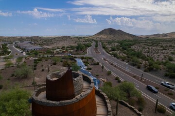 Aerial view of Estrella Star Tower by the highway in the countryside in Goodyear, Arizona