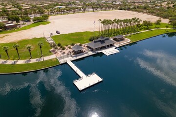 Aerial view of North Lake with white pier and lush green vegetation the shore in Goodyear, Arizona