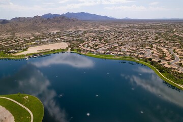 Aerial view of North Lake and Goodyear, Arizona cityscape with mountains in the background