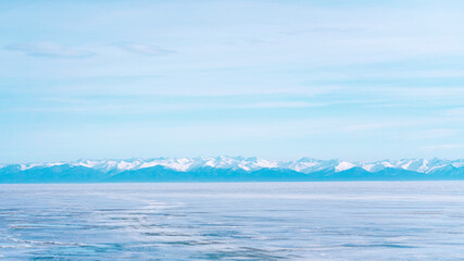 Naklejka na ściany i meble Winter landscape with mountains and Lake Baikal in Siberia on a sunny day.