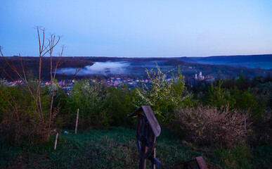morning fog above a village in Romania.