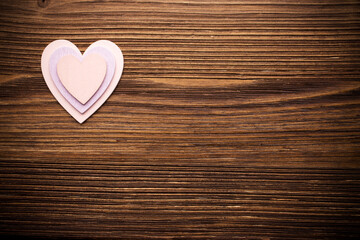 Fototapeta na wymiar Wood hearts on a wooden background.