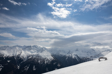 Fototapeta na wymiar Bright mountain scenery on a sunny winter day in the Austrian Alps