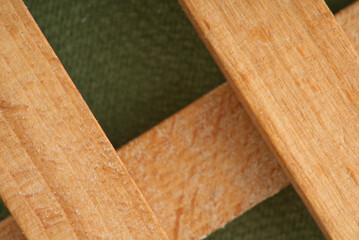 Wooden cage on a green background. Closeup