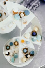 Vertical shot of artisan candies on a decorative vase