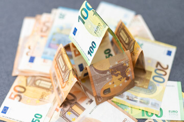 Cottage made of euro banknotes, housing loan. 