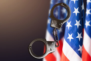 handcuffs on the background of the USA flag, the concept of crime in the United States of America