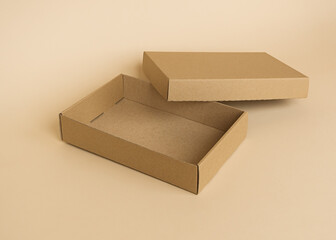 empty cardboard box on a beige background. eco-friendly packaging, recycling, shipping concept
