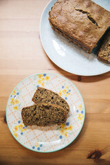 Zucchini Bread Loaf and Slices on a Floral Plate with Natural Lighting