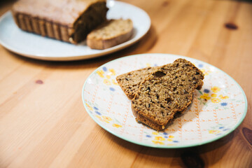 Zucchini Bread Loaf and Slices on a Floral Plate with Natural Lighting