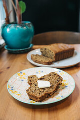 Zucchini Bread Loaf and Slices on a Floral Plate with Natural Lighting