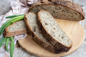 Fresh homemade rye bread. Round bread cut into pieces.