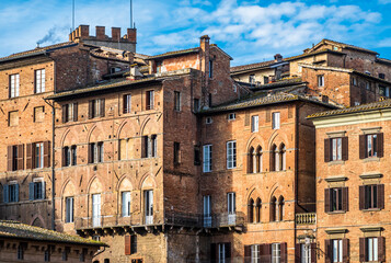 Fototapeta na wymiar historic buildings at the old town of Siena in italy