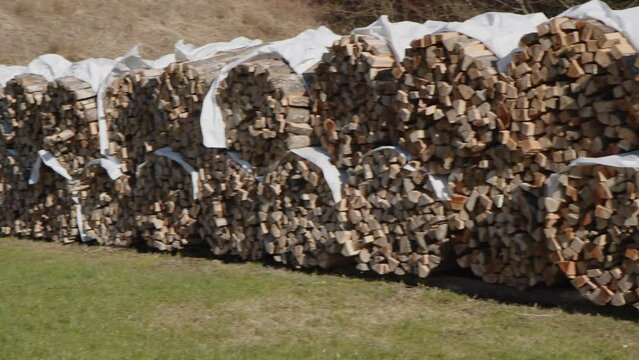 row of logstacks at outdoor woodyard