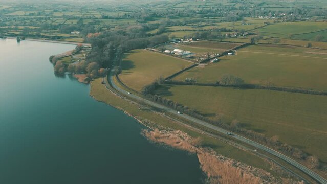 Aerial drone shot of blue water lake in countryside at Chew Valley Lake, Somerset