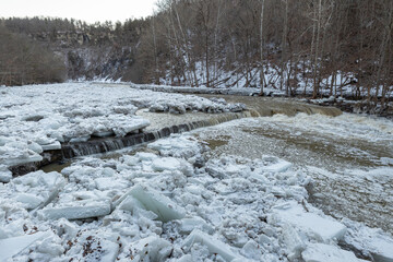 Huge chunks of ice cover parts of Taughannock Creek in the winter along the gorge trail in Taughannock Falls State Park, Ithaca, New York, USA