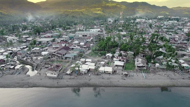 Aerial view of typhoon devastated shoreline SE Asia
