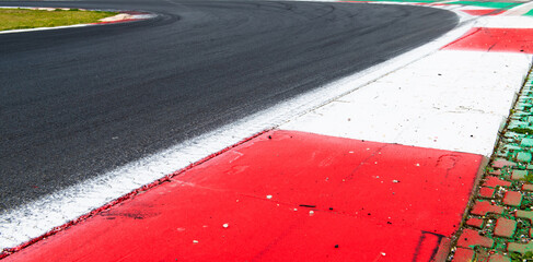 Motor sport asphalt race track and curbs turn close up