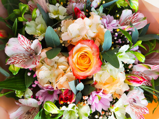 A gorgeous bouquet of flowers packed in beige foamiran. Rose, phlox, irises, wild orchids, chrysanthemums. Present for birthday, anniversary, wedding © AlyaRo