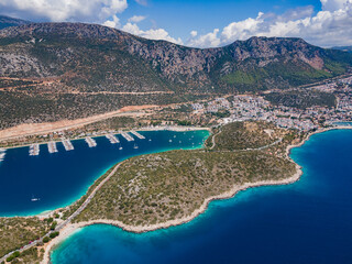 Aerial photo of Setur Kaş Marina in Antalya, Turkey. Displaying yachts, turquoise waters and cityscape.