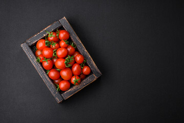 Fresh red cherry tomatoes in a wooden vintage box