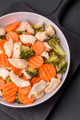 Delicious dish consisting of pieces of boiled chicken, broccoli and carrots