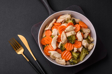 Delicious dish consisting of pieces of boiled chicken, broccoli and carrots