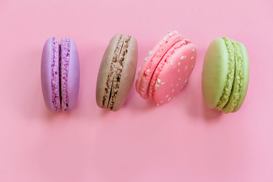 Macarons cakes or macaroon on pink background