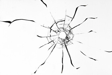 Broken glass by gunshot, crack texture with bullet hole on white background