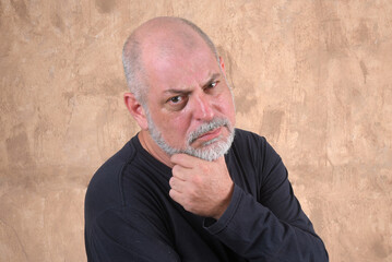 Happy handsome elderly casual man at home, smiling. Portrait of a middle aged adult, older casual...