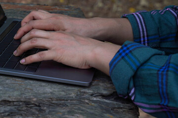 person typing on laptop