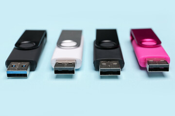 USB flash drives on blue background
