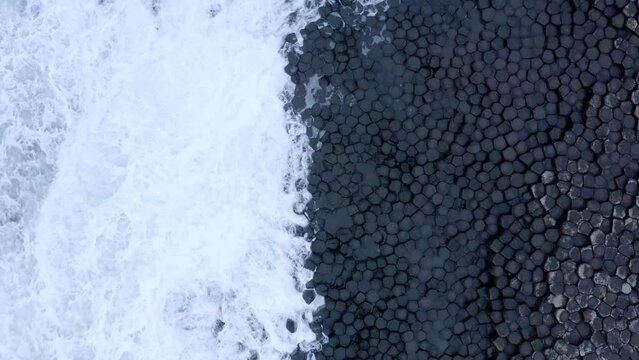Ocean Waves Crashing Against Hexagonal Basalt Rock Formation at Giant's Causeway