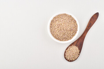 Ajwain spice in spoon on white background, bishop seeds