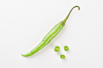 Top view of green chilli on white background