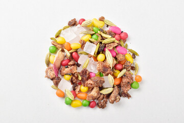 Top view of sugar coated saunf on white background, mouth freshener